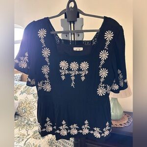 Chic Black Blouse with White Floral Accents